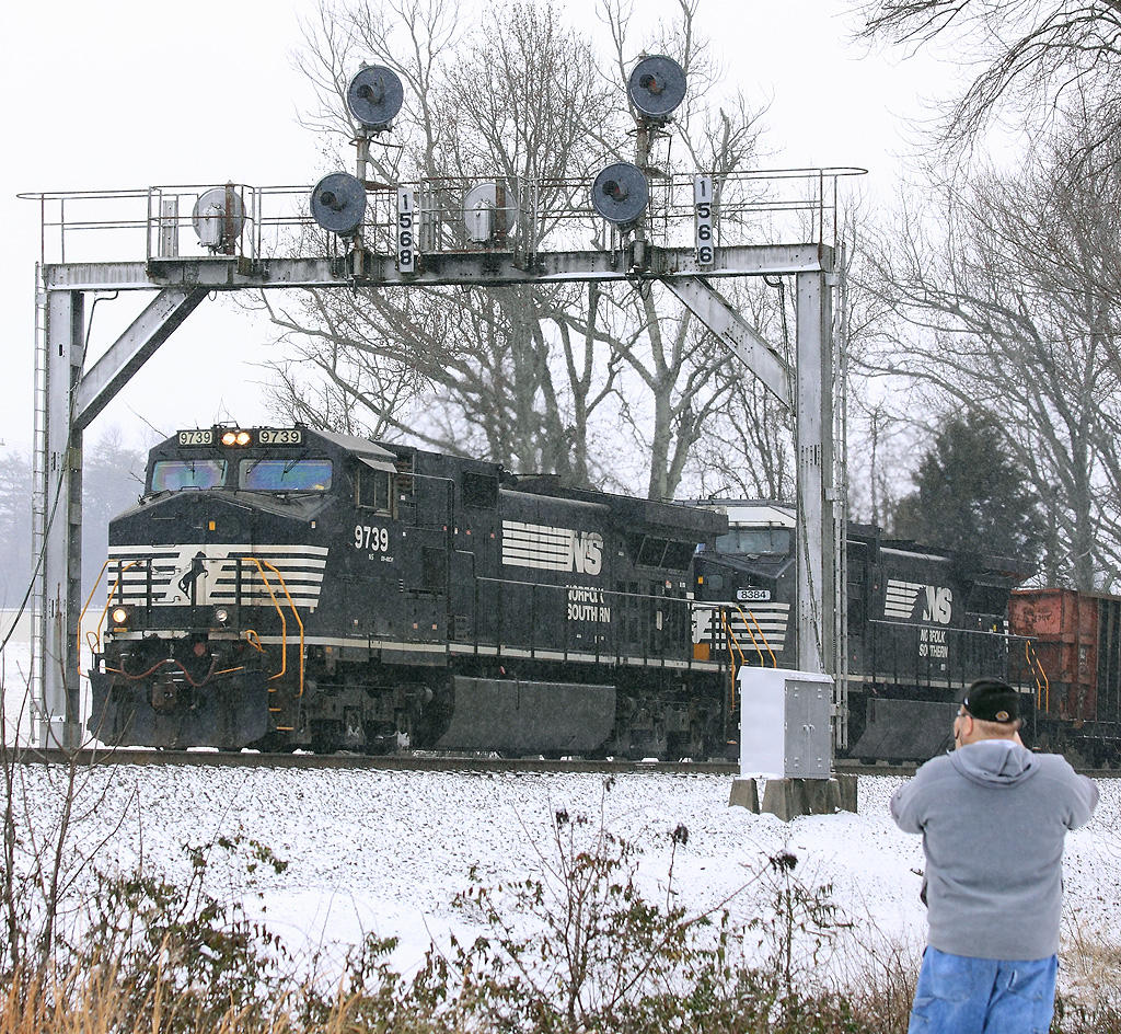 NS 177 rolls down Norwood hill in a light snow as Mr. Hoyden gets his shot of the train and those classic Southern signals 