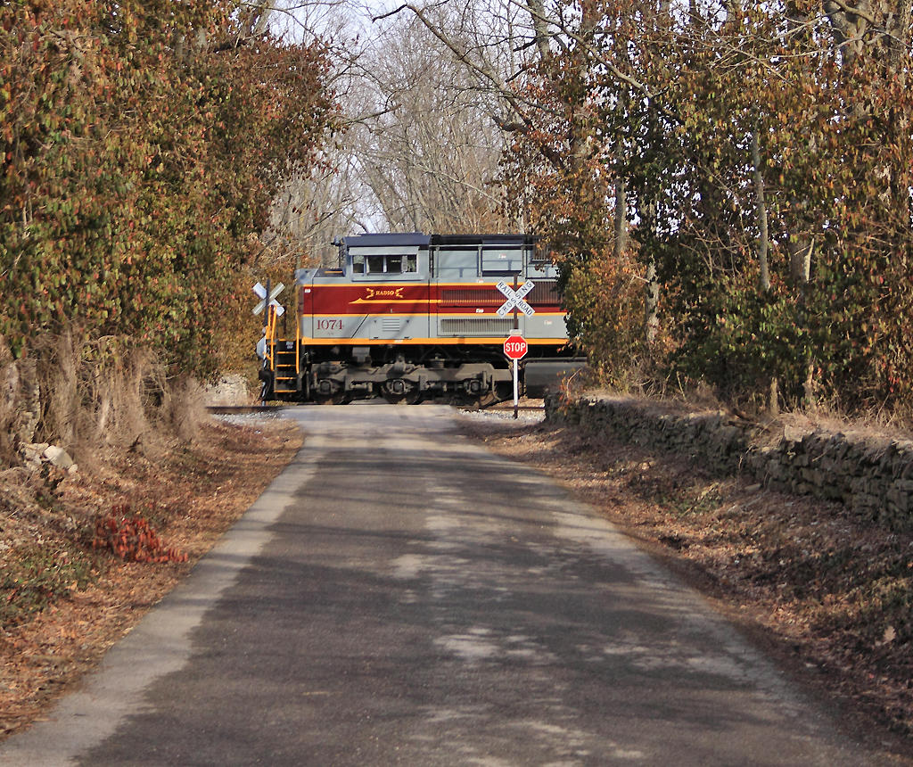 DL&W 1074 framed by the rock fences and trees at West Talmage 