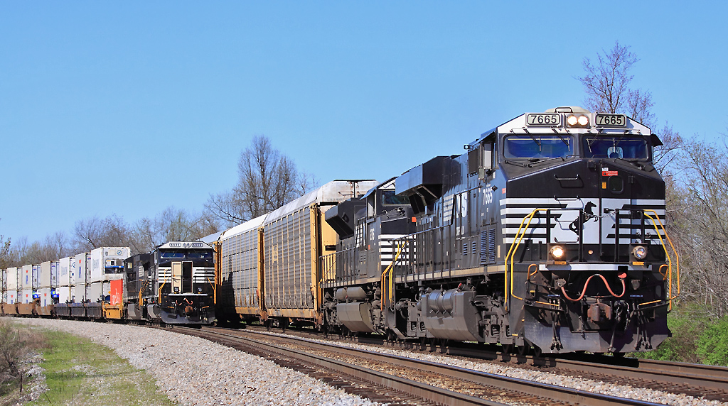 223 stands on #2 track at Junction City after the crew went on the law, as 23G passes by. 