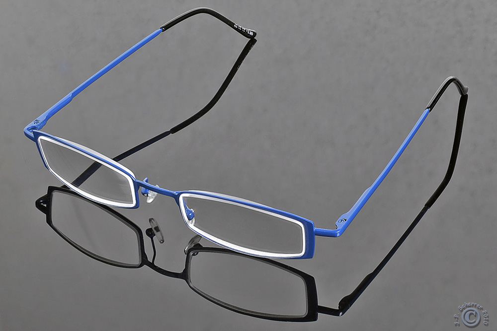 The blue eyeglasses !