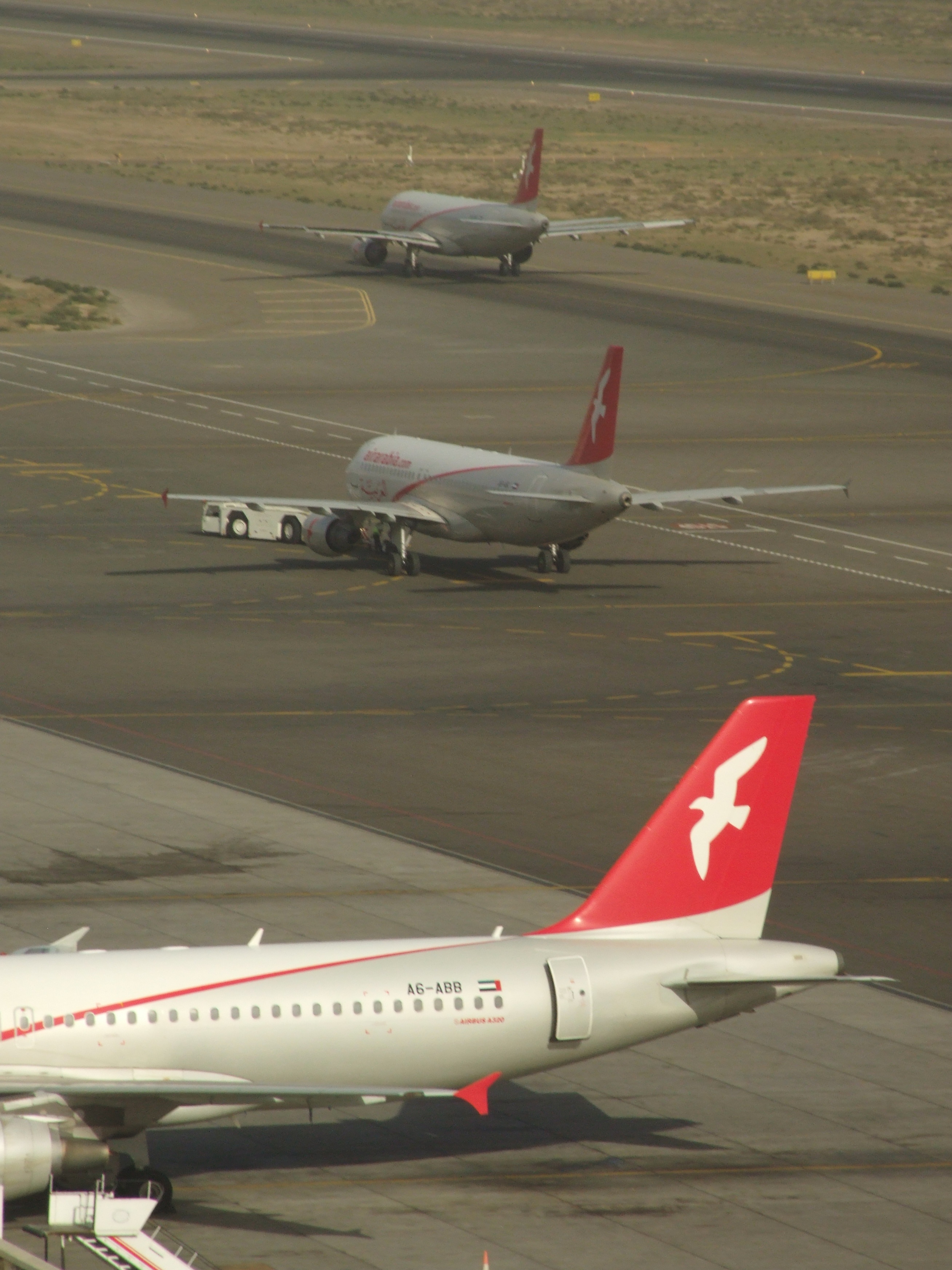 0908 26th February 08 Three Air Arabia departures from Sharjah Airport.JPG