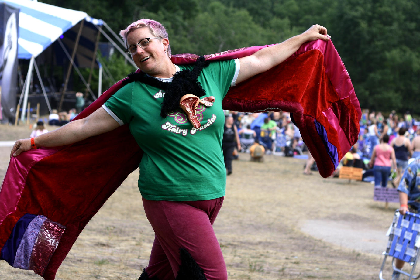 Sara twirls her vagina cape on the Night Stage field