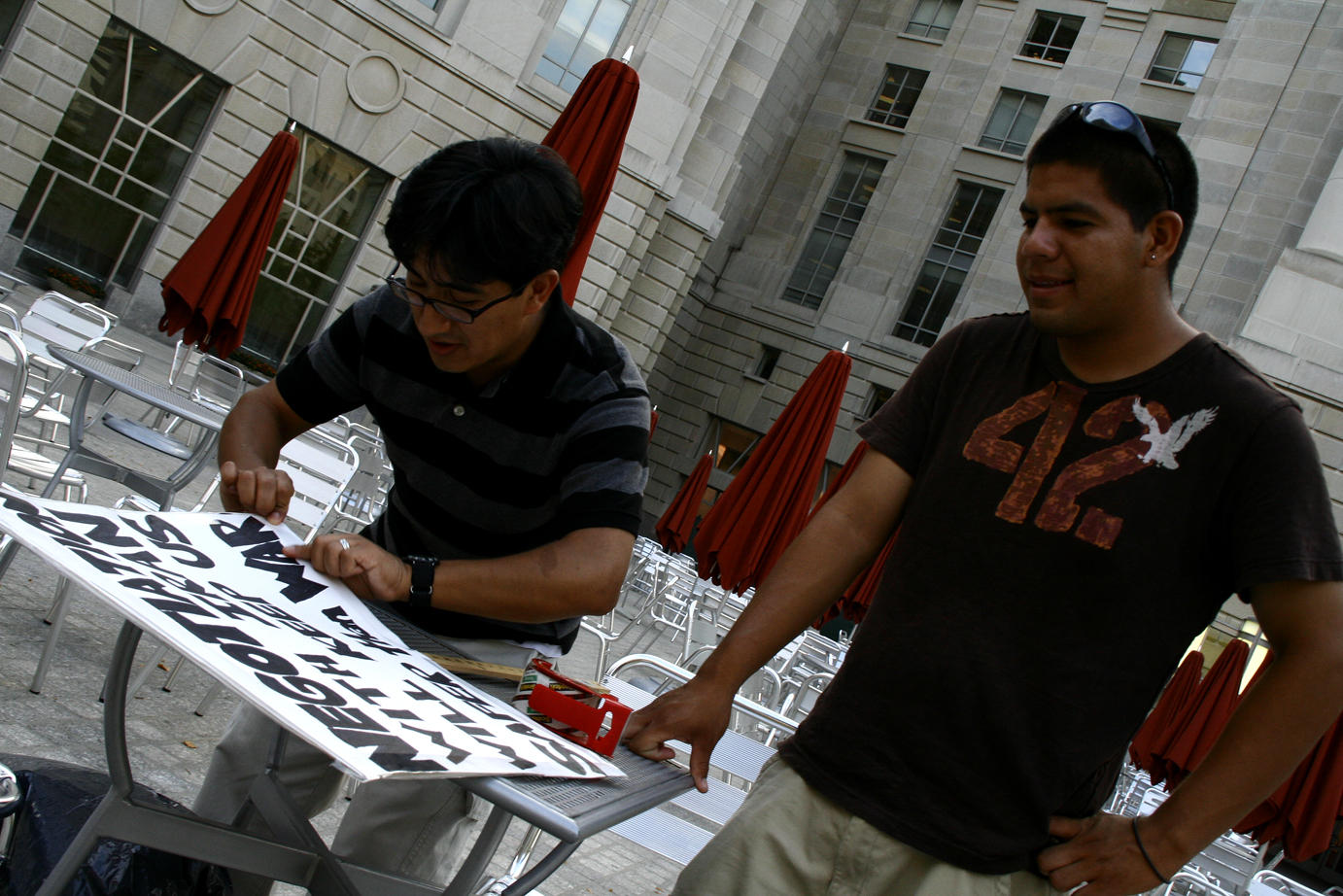 Luis & Alfredo from Peru help tape up my sign