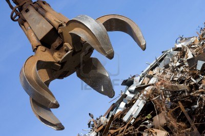 4758737-crane-grabber-up-on-the-rusty-metal-heap.jpg