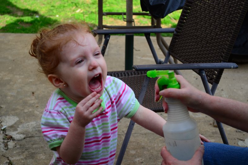 Poor girl...Grandma wont give her a drink out of a cup:)
