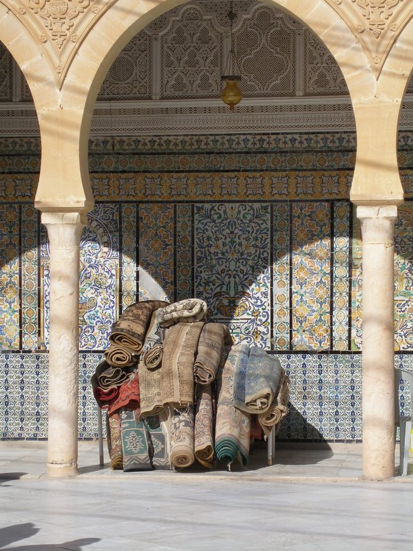 Kairouan - small mosque courtyard - rugs made by brides