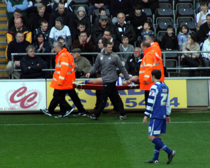 Coppinger Stretchered Off