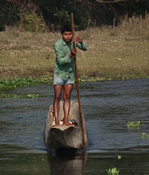  Boatman and hollowed out tree trunk