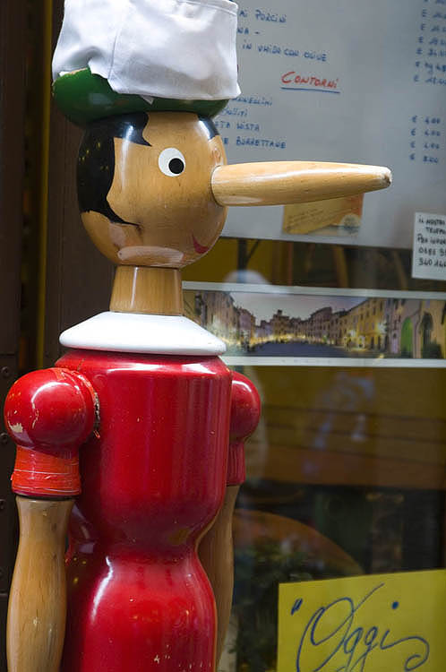 Pinocchio outside a restaurant