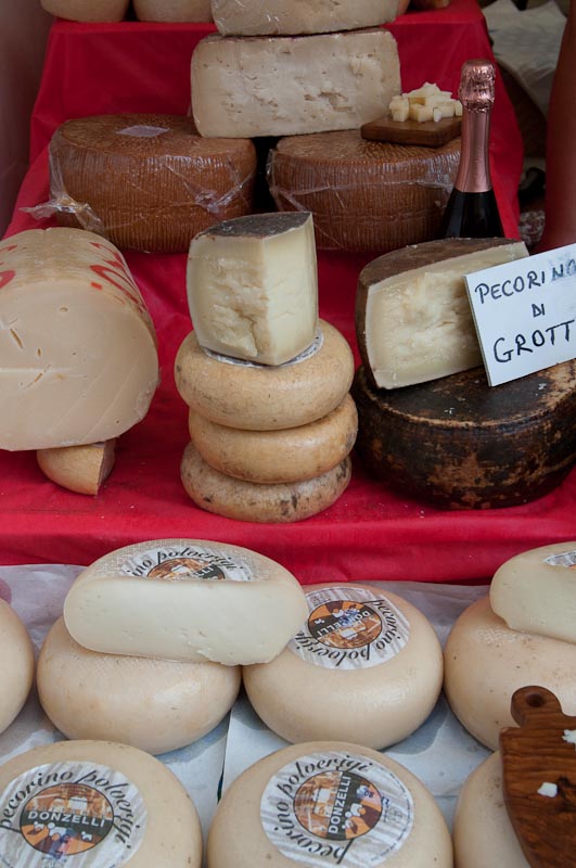 Country-style cheeses displayed