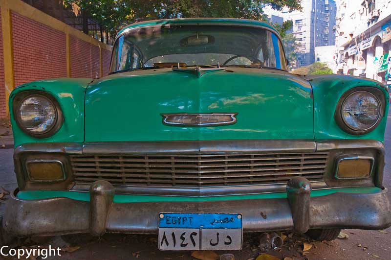 A fading Chevrolet Bel Air, parked in a back street