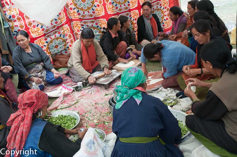 Ladakhi women prepare momos at a carnival in Hunder