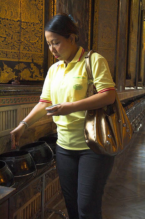 Giving alms at Wat Po, Bangkok
