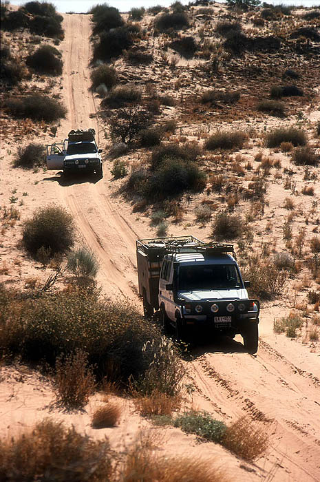 Crossing the dunes in the scorching heat of midday