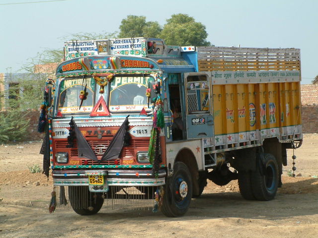 Disco trucks covered with paintings, ornaments, reflectors, hammered metal fittings, woodcarvings ...