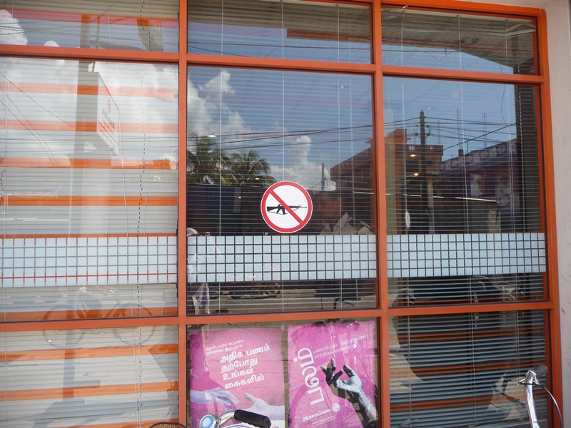 No guns allowed - sign in bank window
