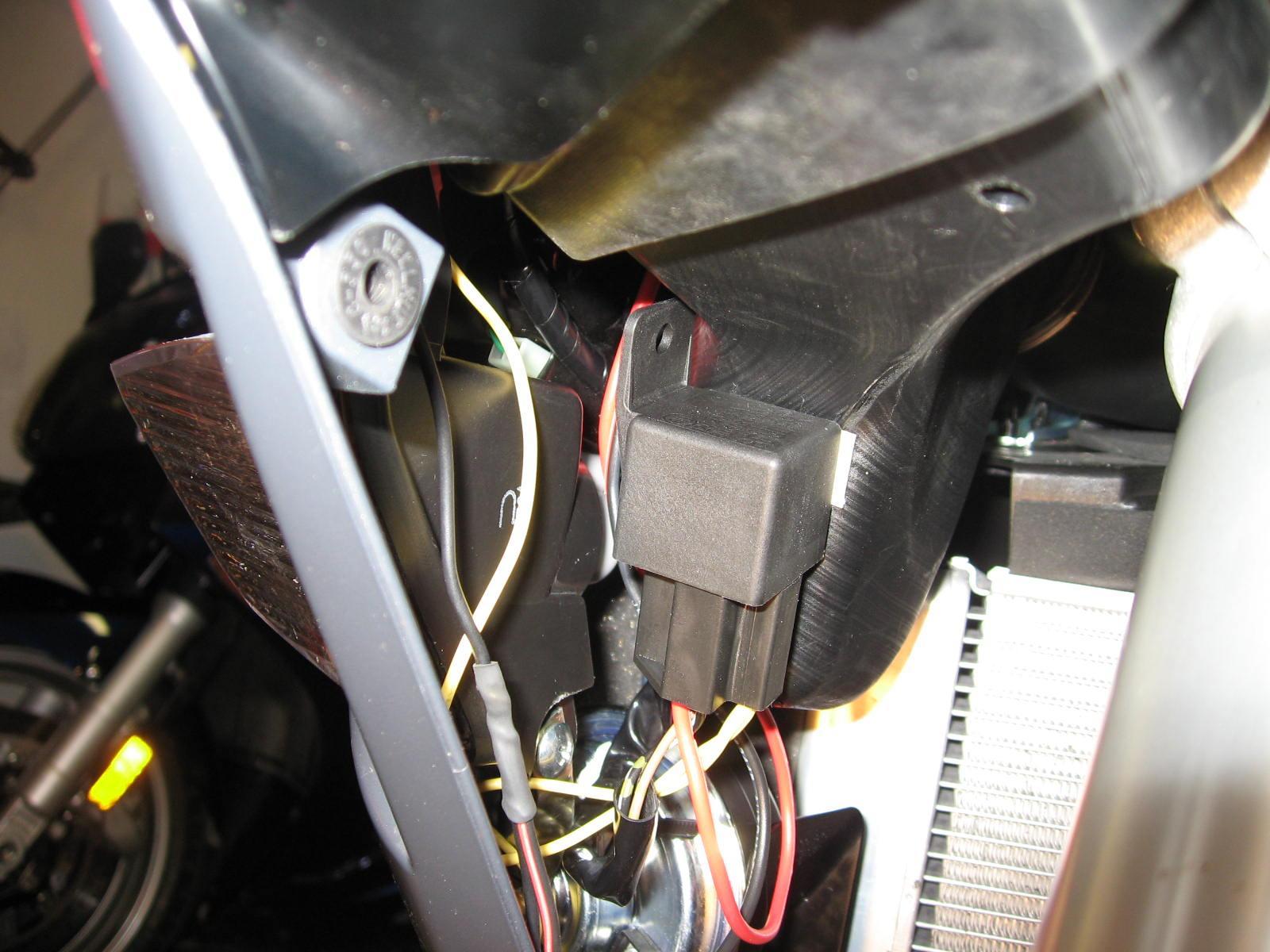 Horn relay mounted to air intake plenum