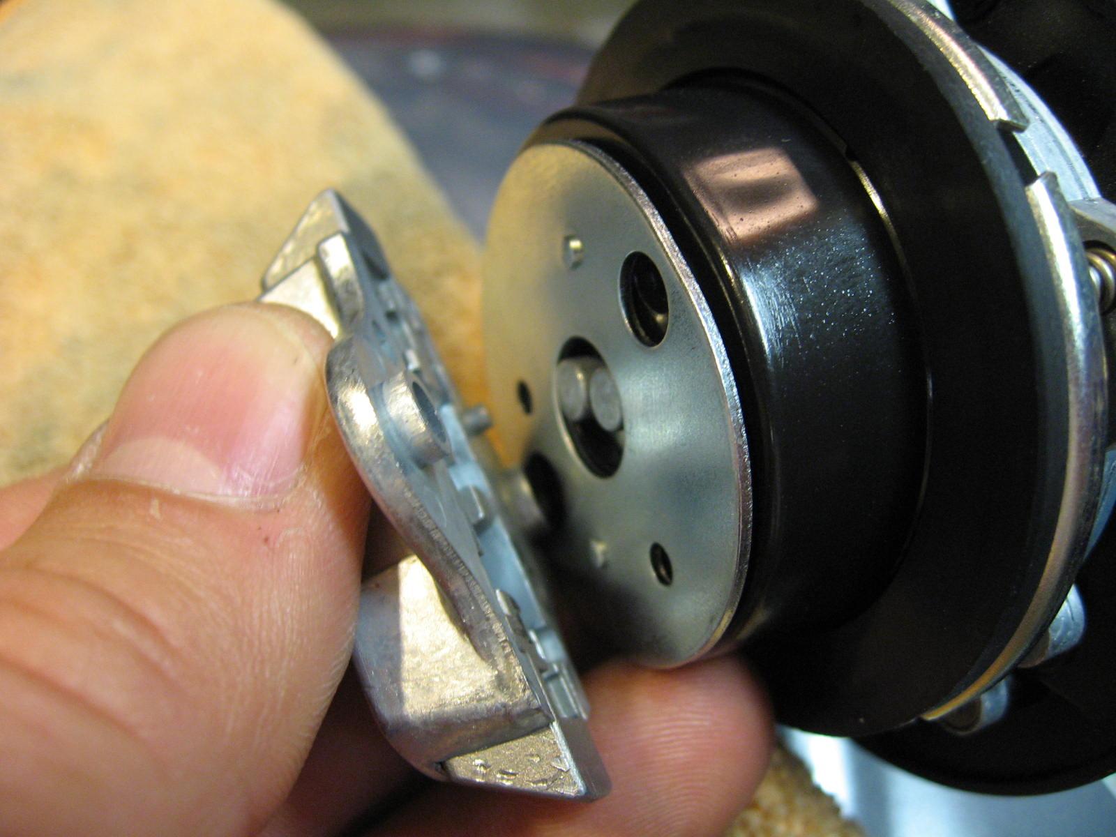 Then I put the latch back in place and screw down.