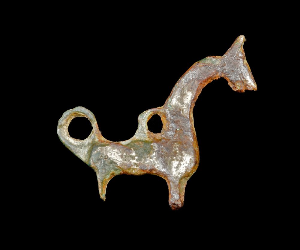 Viking Age bronze pendant of a stylized horse, 24 mm long, 10th-11th C, Baltic/NW Russia