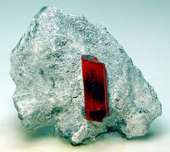 Realgar, doubly terminated 2.5 cm crystal on 6.5 cm matrix. Baia Sprie, Romania, found December 2005.