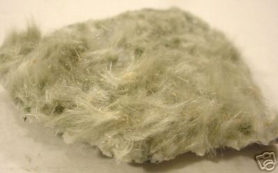 15. Amianth on Gneiss. That's German for Byssolite. Switzerland. Looks like a hairy rock.