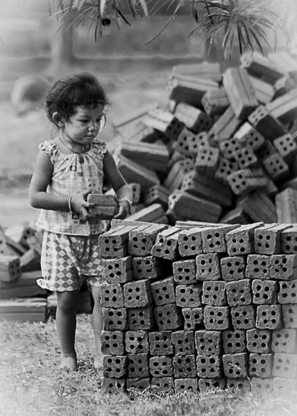 Child playing with bricks
