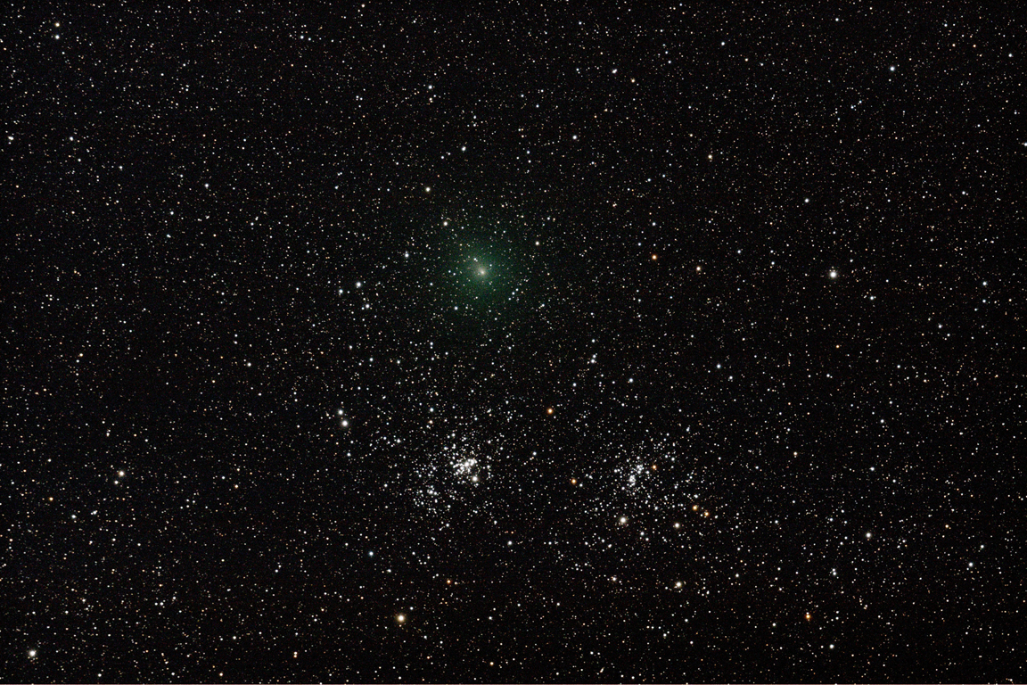 Comet C103P Passing the Double Cluster