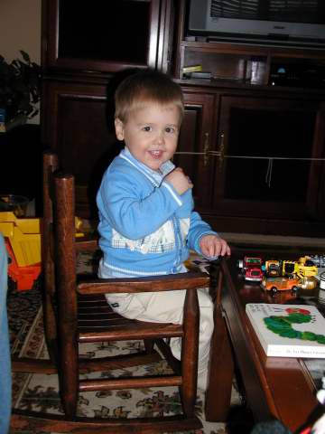at home, in his new chair