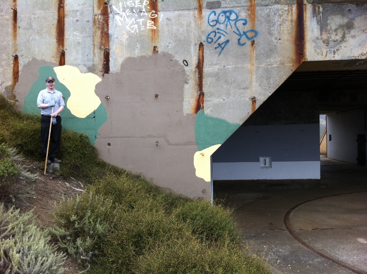 During: Painting out graffiti with camouflage