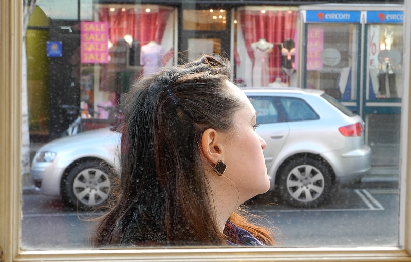 A face through a dusty window