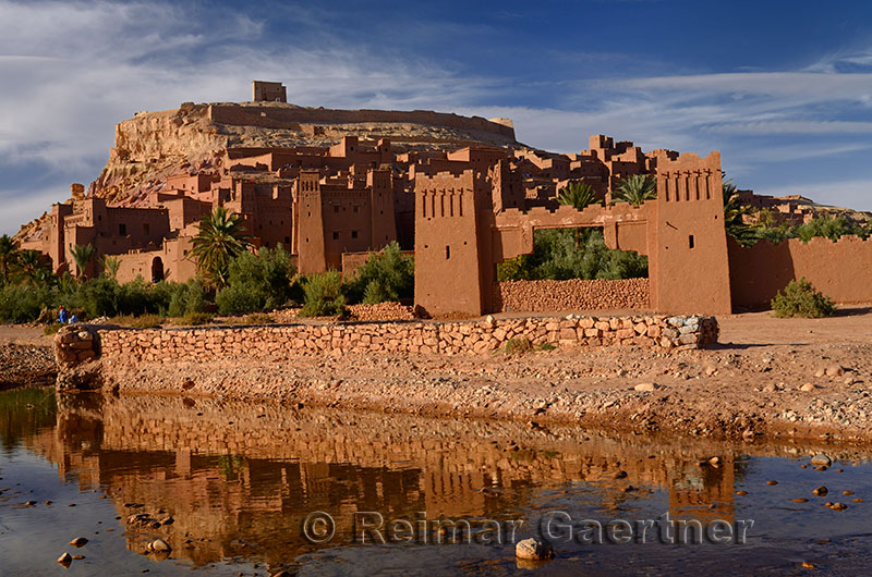 Ait Benhaddou reflected in the water of Ounila River or Wadi Mellah near Ouarzazate Morocco
