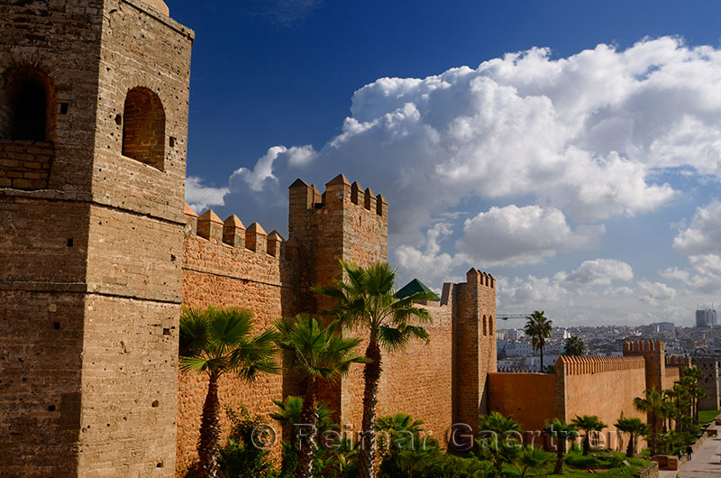 Thick ramparts of the Oudaia Kasbah with modern Rabat Morocco in the distance