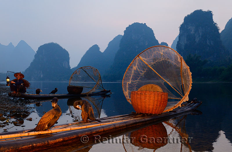 Cormorant fishing raft with wicker basket and net on the shore of the Li river Yangshuo China