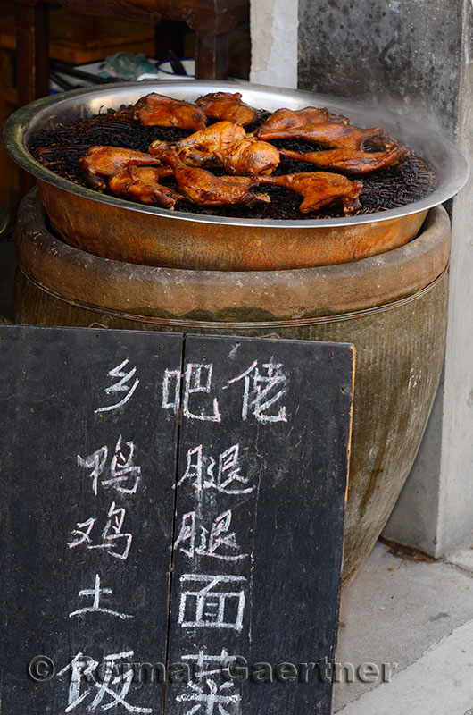 Sign board for street food hot chicken for sale in Hongcun village Anhui Province China