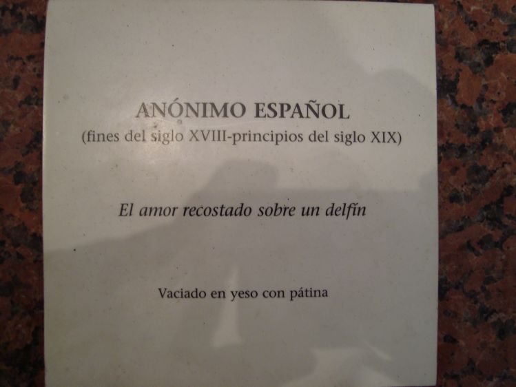 El amor recostado sobre un delfn