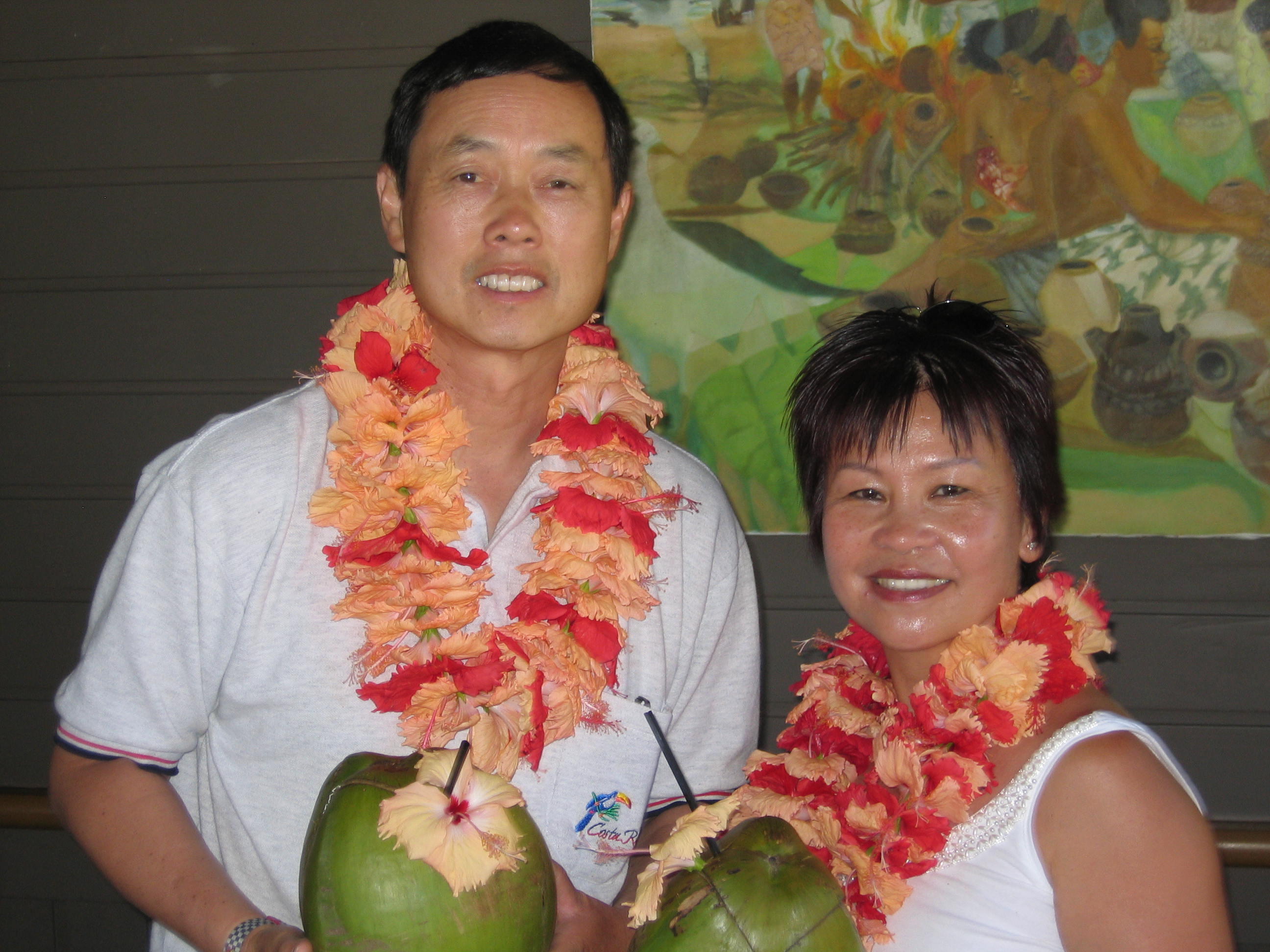 Ken and Lin are welcomed with cold refreshing coconut drink!