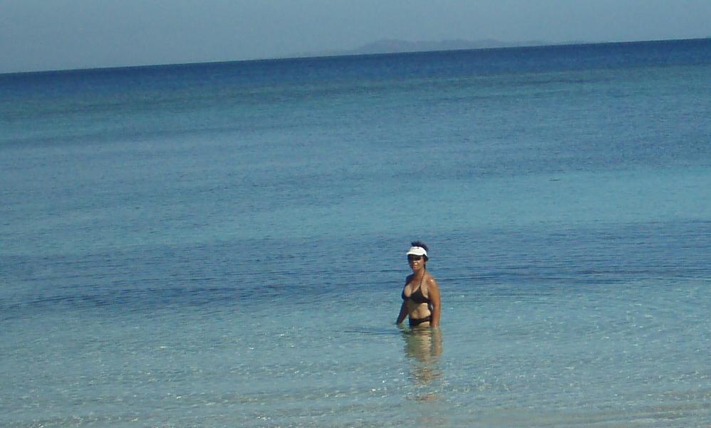Lin enjoying her time on the secluded beach and crystal clear water.