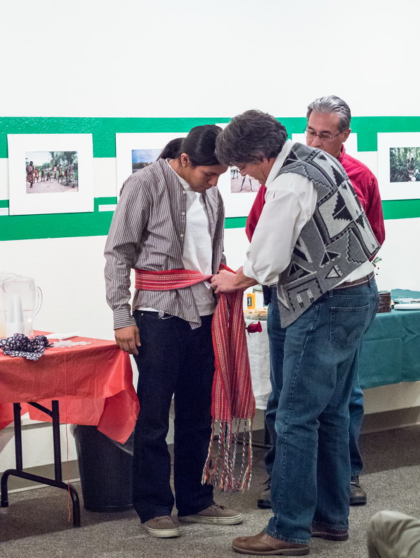 Ben Shendo receiving ceremonial sash from Visiting Scholar Dr. Dan McDonald