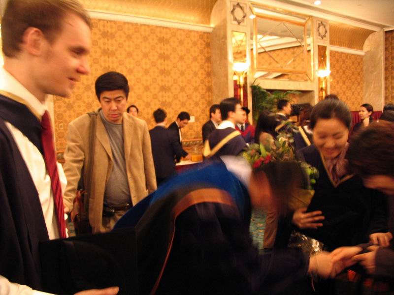 Dr Chan bowing to mother of MBA