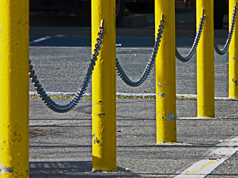 b for Barrier - Linked Yellow Poles