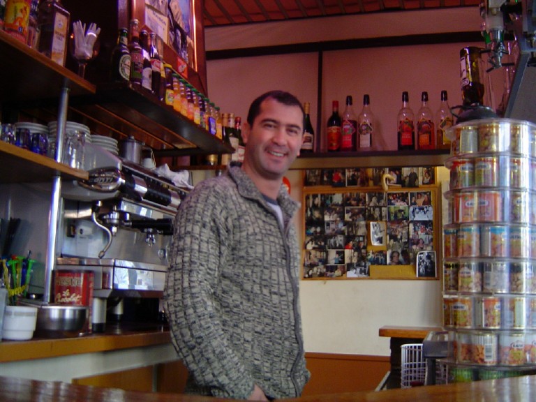 Proprietor behind the comptoir