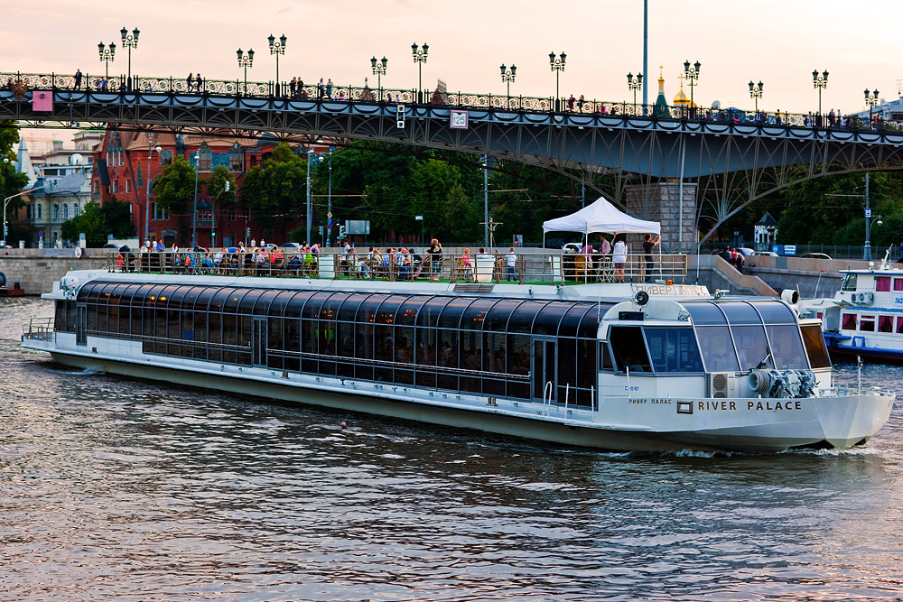 Sunset in Moscow... pleasure boat by Moscow river...