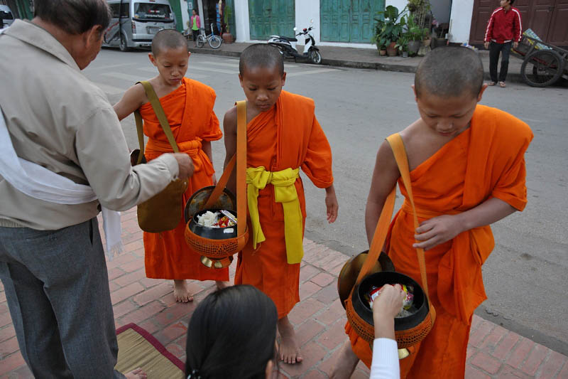 Monks collecting alms