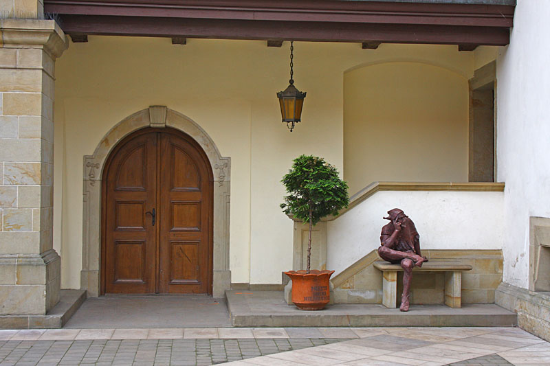 Castle Niepolomice with statue of Stanczyk