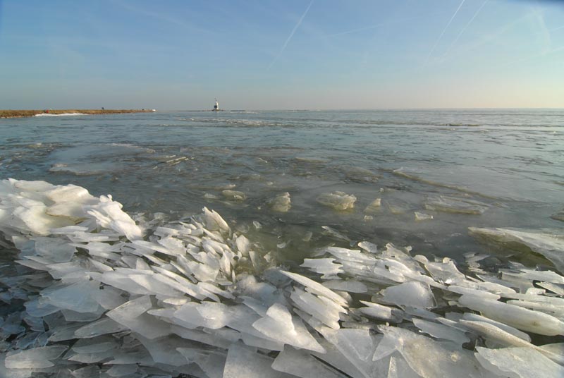   Drifting ice  and lighthouse.