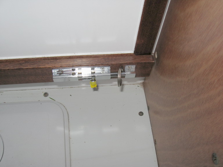 Slide bolt engaged, covering pin.