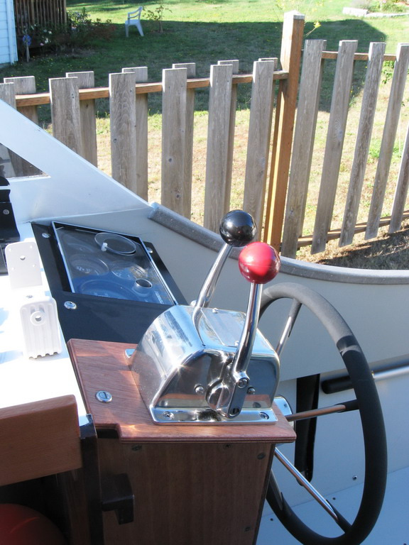 Fingers of left hand operate shift; palm controls throttle.  Easy -- simple.