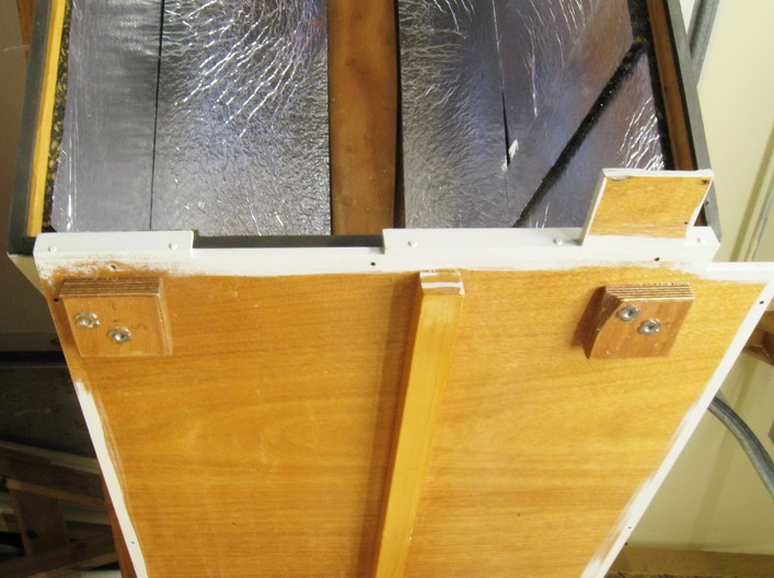Overall view of both hinge placements, underside; starboard side is to left in photo.