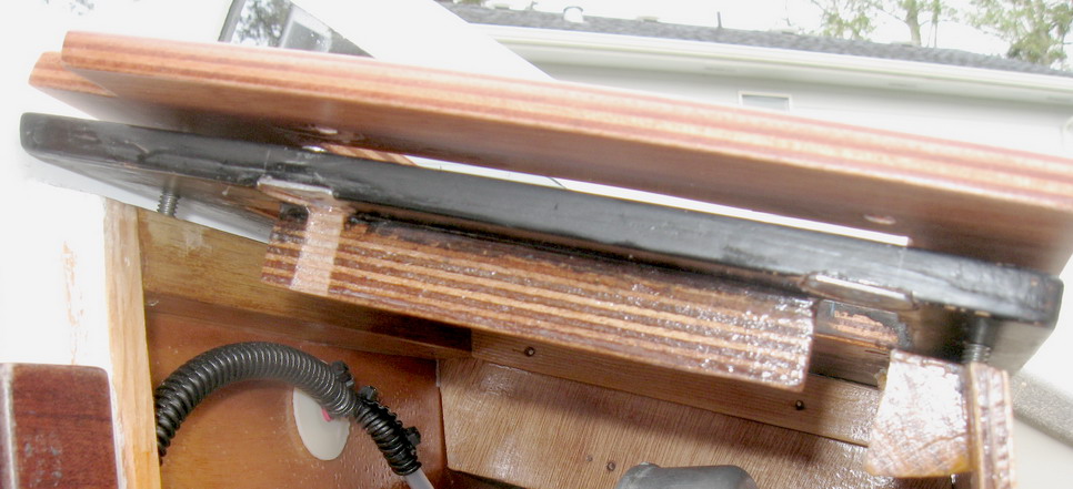 Plates mated; port side view; plywood piece indexes vertical helm panel.