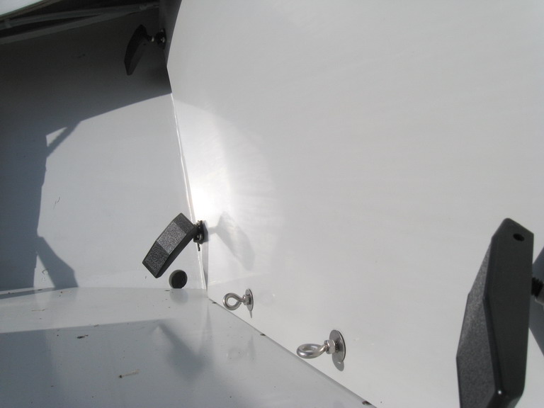 Fourth T-nut app:  ringbolts seal lower edge of frame 12 panel against leakage.